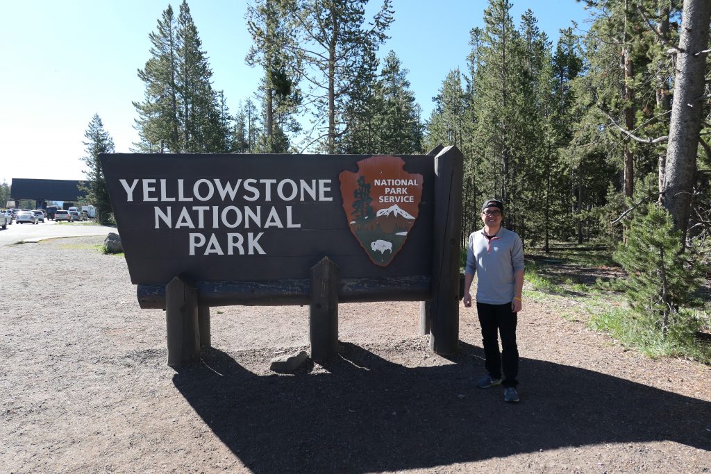 In front of Yellowstone sign